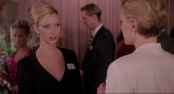 Movie still from “Romy and Michele's High School Reunion” (1997), directed by David Mirkin – Two women are talking to each other at a party; Close Up shot, Over the shoulder angle