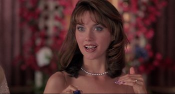 Movie still from “Romy and Michele's High School Reunion” (1997), directed by David Mirkin – A person wearing a necklace; Close Up shot, Over the shoulder angle