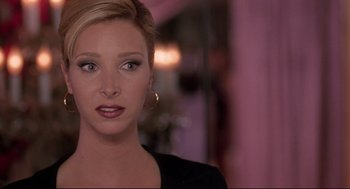 Movie still from “Romy and Michele's High School Reunion” (1997), directed by David Mirkin – A person wearing a black shirt; Close Up shot, Over the shoulder angle