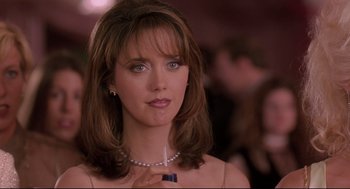 Movie still from “Romy and Michele's High School Reunion” (1997), directed by David Mirkin – A person wearing a necklace; Close Up shot, Over the shoulder angle