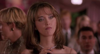Movie still from “Romy and Michele's High School Reunion” (1997), directed by David Mirkin – A person wearing a necklace; Close Up shot, Over the shoulder angle