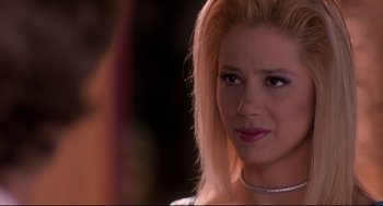 Movie still from “Romy and Michele's High School Reunion” (1997), directed by David Mirkin – A person wearing a necklace; Close Up shot, Over the shoulder angle