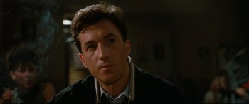 Movie still from “'Round Midnight” (1986), directed by Bertrand Tavernier – A person wearing a jacket; Close Up shot, Over the shoulder angle