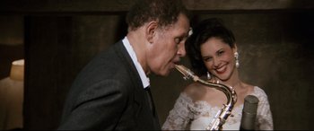 Movie still from “'Round Midnight” (1986), directed by Bertrand Tavernier – A man and a woman are kissing each other; Close Up shot, Low angle