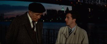 Movie still from “'Round Midnight” (1986), directed by Bertrand Tavernier – A man and a man in a suit and tie; Medium shot, Over the shoulder angle