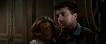 Movie still from “'Round Midnight” (1986), directed by Bertrand Tavernier – A man and a woman posing for a picture; Close Up shot, Low angle