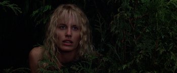 Movie still from “Roxanne” (1987), directed by Fred Schepisi – A woman with blonde hair and blue eyes in the bushes; Close Up shot, Over the shoulder angle