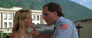 Movie still from “Roxanne” (1987), directed by Fred Schepisi – A man and a woman are looking at one another; Close Up shot, Low angle