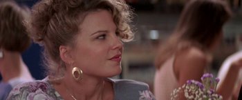 Movie still from “Roxanne” (1987), directed by Fred Schepisi – A person wearing a dress; Close Up shot, Over the shoulder angle