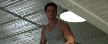 Movie still from “Roxanne” (1987), directed by Fred Schepisi – A person wearing a tank top; Close Up shot, Low angle