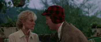 Movie still from “Roxanne” (1987), directed by Fred Schepisi – A man and a woman wearing a red and black hat; Close Up shot, Over the shoulder angle