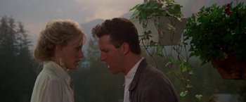 Movie still from “Roxanne” (1987), directed by Fred Schepisi – A man and a woman face to face in front of a tree; Close Up shot, Low angle