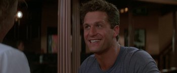 Movie still from “Roxanne” (1987), directed by Fred Schepisi – A person with a smile on his face; Close Up shot, Low angle