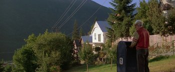 Movie still from “Roxanne” (1987), directed by Fred Schepisi – A view of some houses in a rural area; Extreme Wide shot, Low angle