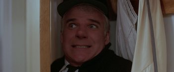 Movie still from “Roxanne” (1987), directed by Fred Schepisi – A person wearing a hat and a suit; Close Up shot, Low angle
