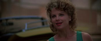 Movie still from “Roxanne” (1987), directed by Fred Schepisi – A person with curly blonde hair; Close Up shot, Over the shoulder angle