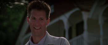 Movie still from “Roxanne” (1987), directed by Fred Schepisi – A person smiling for the camera; Close Up shot, Low angle