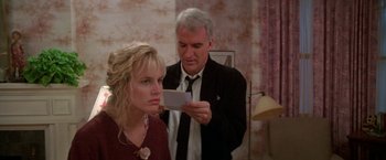 Movie still from “Roxanne” (1987), directed by Fred Schepisi – A man and a woman looking at a piece of paper; Close Up shot, Over the shoulder angle