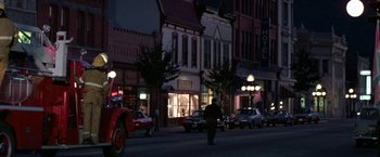 Movie still from “Roxanne” (1987), directed by Fred Schepisi – A man walking down a street at night; Extreme Wide shot, High angle