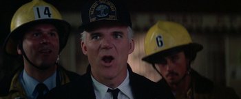 Movie still from “Roxanne” (1987), directed by Fred Schepisi – An older man wearing a uniform and a hat; Close Up shot, Low angle