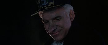 Movie still from “Roxanne” (1987), directed by Fred Schepisi – A person wearing a hat; Close Up shot, High angle