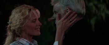 Movie still from “Roxanne” (1987), directed by Fred Schepisi – A man and a woman face to face with one of them smiling; Close Up shot, Over the shoulder angle