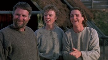 Movie still from “Royal Deceit” (1994), directed by Gabriel Axel – A group of men standing next to each other; Medium shot, Low angle