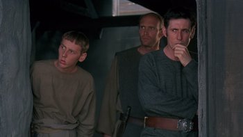 Movie still from “Royal Deceit” (1994), directed by Gabriel Axel – A group of men standing next to each other; Medium shot, Low angle