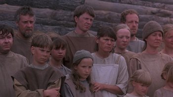 Movie still from “Royal Deceit” (1994), directed by Gabriel Axel – A group of people standing next to each other; Medium shot, High angle