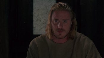 Movie still from “Royal Deceit” (1994), directed by Gabriel Axel – A person with long blonde hair; Close Up shot, Over the shoulder angle