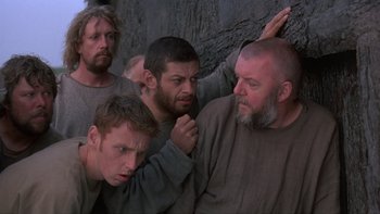Movie still from “Royal Deceit” (1994), directed by Gabriel Axel – A group of men standing next to each other; Medium shot, Low angle