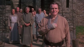 Movie still from “Royal Deceit” (1994), directed by Gabriel Axel – A group of people standing in front of each other; Medium shot, Low angle