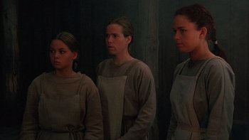 Movie still from “Royal Deceit” (1994), directed by Gabriel Axel – A group of women standing next to each other in a room; Medium shot, High angle