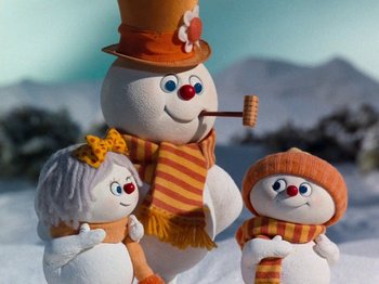 Movie still from “Rudolph and Frosty's Christmas in July” (1979), directed by Jules Bass – A group of snowmen that are standing in the snow; Close Up shot, Low angle