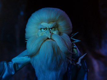 Movie still from “Rudolph and Frosty's Christmas in July” (1979), directed by Jules Bass – The head of a bearded creature; Close Up shot, Low angle