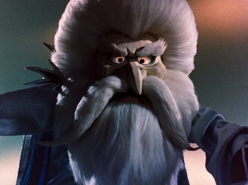 Movie still from “Rudolph and Frosty's Christmas in July” (1979), directed by Jules Bass – The face of a bearded man; Close Up shot, Low angle