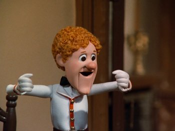 Movie still from “Rudolph and Frosty's Christmas in July” (1979), directed by Jules Bass – The head and arms of a cartoon character; Close Up shot, Low angle