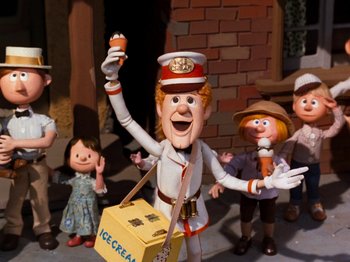 Movie still from “Rudolph and Frosty's Christmas in July” (1979), directed by Jules Bass – A group of people standing next to each other in a room; Medium shot, Low angle