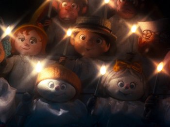 Movie still from “Rudolph and Frosty's Christmas in July” (1979), directed by Jules Bass – A lot of dolls that are lit up; Medium shot, Low angle
