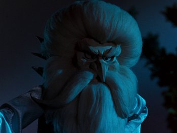 Movie still from “Rudolph and Frosty's Christmas in July” (1979), directed by Jules Bass – The head of a bearded creature; Close Up shot, Low angle