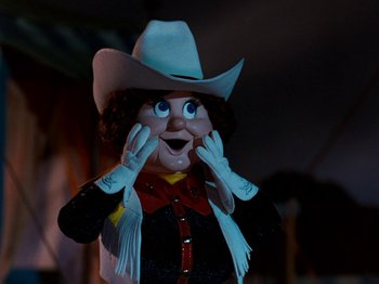 Movie still from “Rudolph and Frosty's Christmas in July” (1979), directed by Jules Bass – A person wearing a cowboy hat; Close Up shot, Low angle