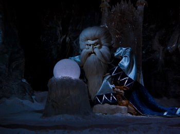 Movie still from “Rudolph and Frosty's Christmas in July” (1979), directed by Jules Bass – An image of a wizard in the snow; Wide shot, Low angle