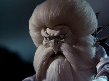 Movie still from “Rudolph and Frosty's Christmas in July” (1979), directed by Jules Bass – The head of a bald eagle; Close Up shot, Low angle