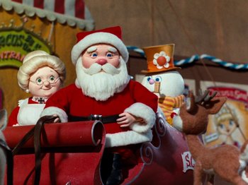 Movie still from “Rudolph and Frosty's Christmas in July” (1979), directed by Jules Bass – Santa and mrs; Medium shot, Low angle