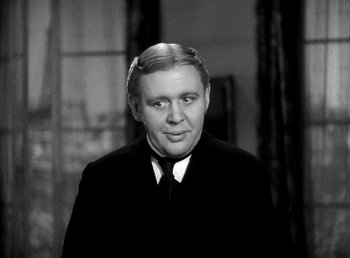 Movie still from “Ruggles of Red Gap” (1935), directed by Leo McCarey – An older man in a suit and tie; Close Up shot, Over the shoulder angle