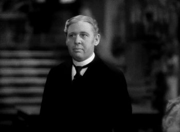 Movie still from “Ruggles of Red Gap” (1935), directed by Leo McCarey – An older man wearing a suit and a tie; Close Up shot, High angle