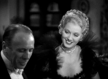 Movie still from “Ruggles of Red Gap” (1935), directed by Leo McCarey – An old black and white photo of a man and a woman; Close Up shot, Over the shoulder angle