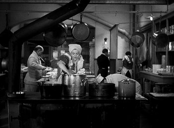 Movie still from “Ruggles of Red Gap” (1935), directed by Leo McCarey – A group of people working in a large kitchen; Wide shot, High angle