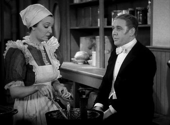Movie still from “Ruggles of Red Gap” (1935), directed by Leo McCarey – A man and a woman are cooking in a kitchen; Medium shot, Low angle