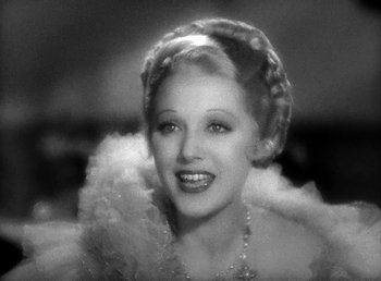 Movie still from “Ruggles of Red Gap” (1935), directed by Leo McCarey – A black - and - white photo of a woman in a dress; Close Up shot, Low angle